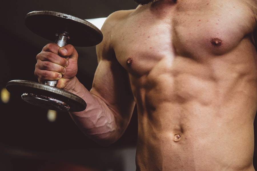 A Person Lifting Weights In A Gym